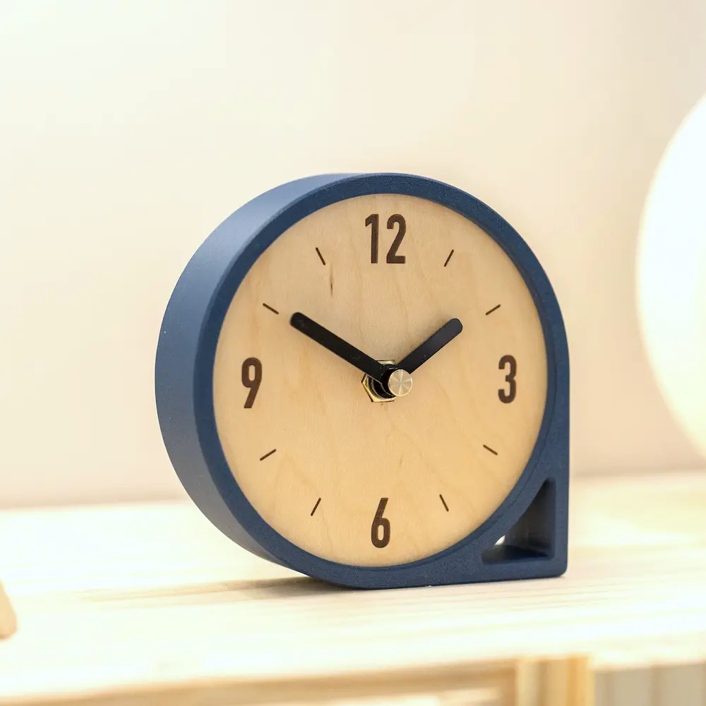Round wooden desk clock with navy frame
